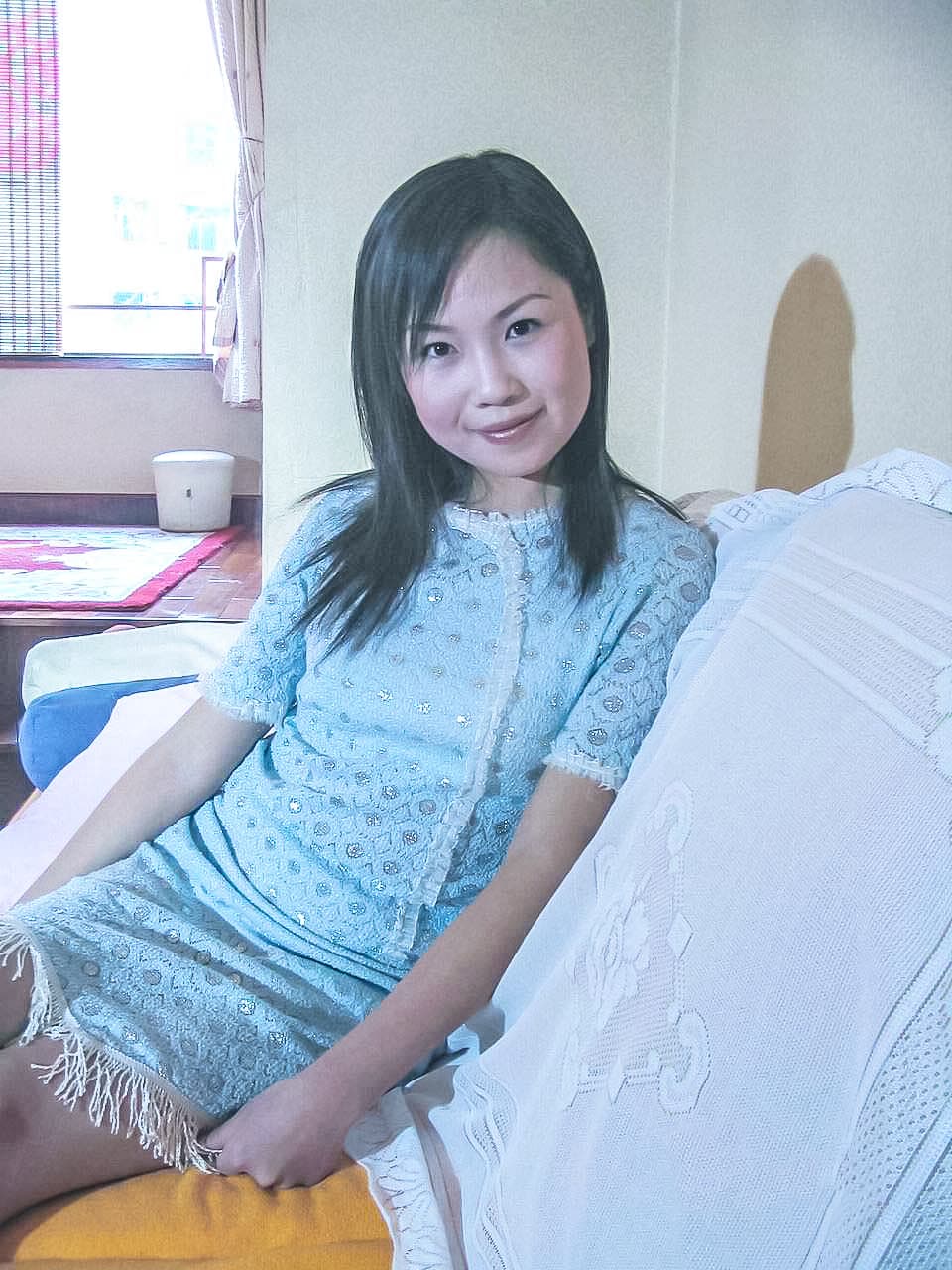 Elegant close-up of a mature woman's arched foot, toes slightly curled, bathed in soft studio light